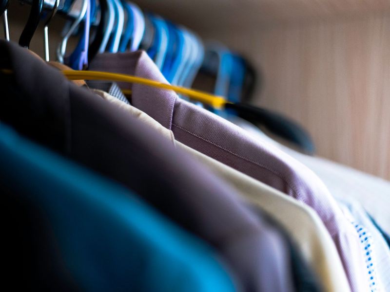 Dress shirts neatly arranged on hangers